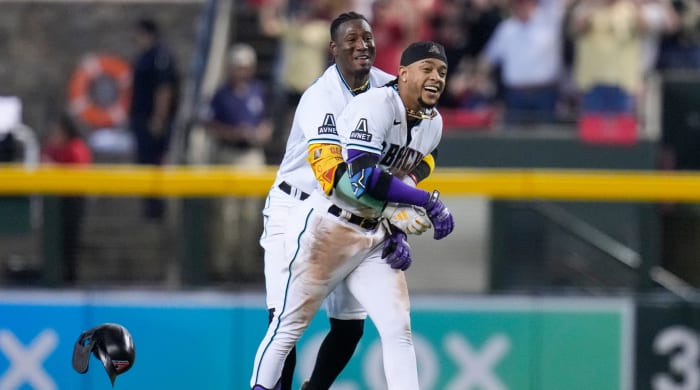 Diamondbacks’ Ketel Marte (4) celebrates his walk-off single with Geraldo Perdomo in Game 3 of the NLCS against the Phillies.